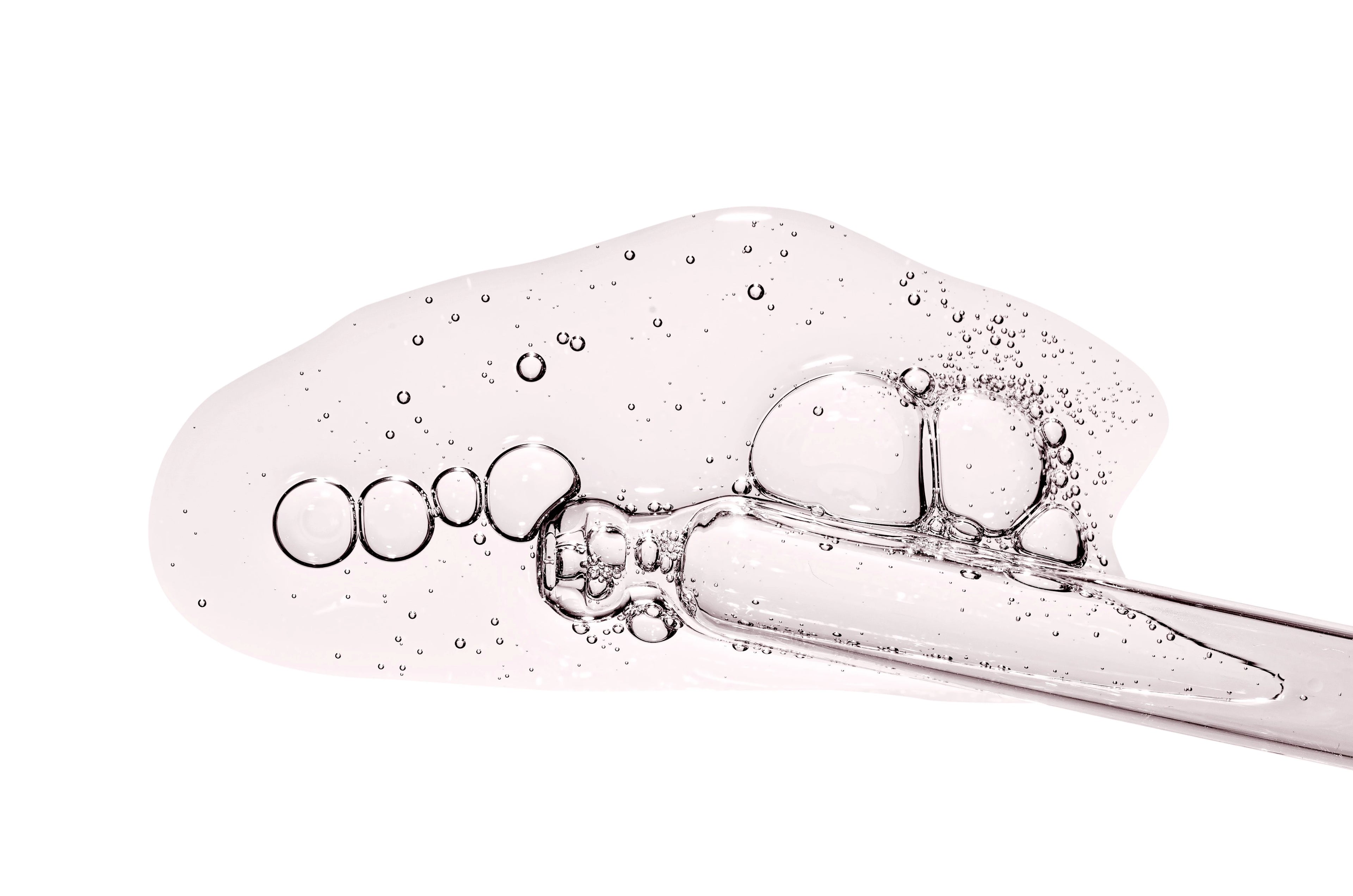 Texture de gel transparent avec bulles et pipette, illustration d’un exfoliant AHA / peeling visage.