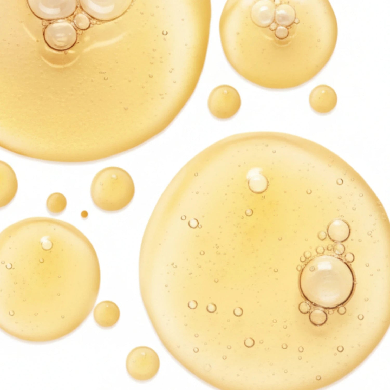 Texture du Gel Booster Antioxydant au ginkgo Seomse, bulles dorées en macro, soin visage antioxydant